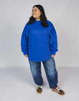 Ashlie is wearing a size XL