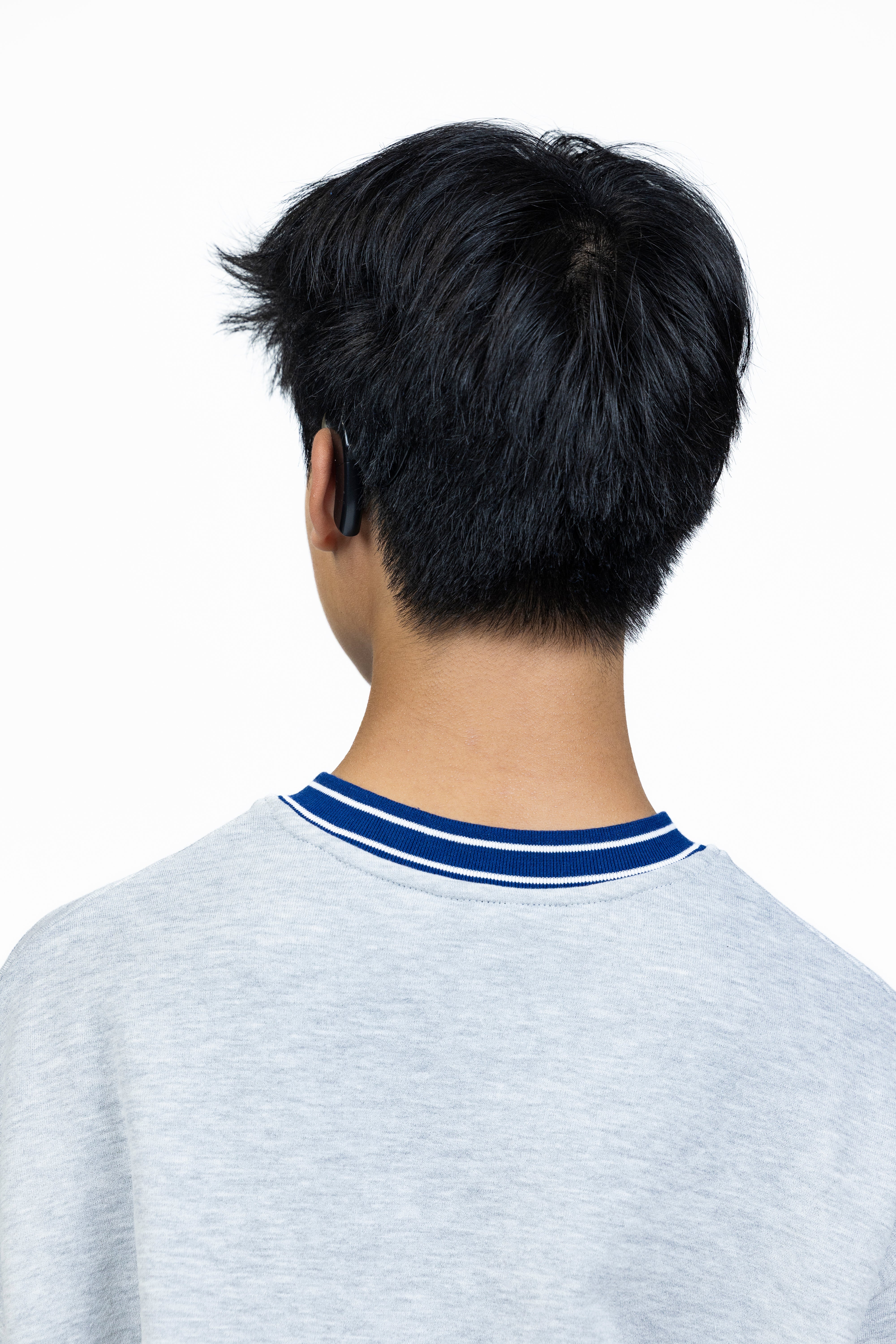 Brayden is wearing a size XS